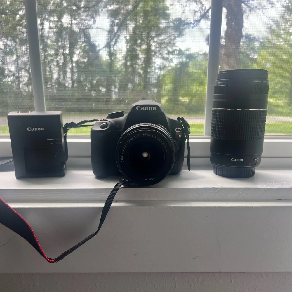 Canon T-5 Camera + Lense + Travel Bag. Had for a few years and never used!
